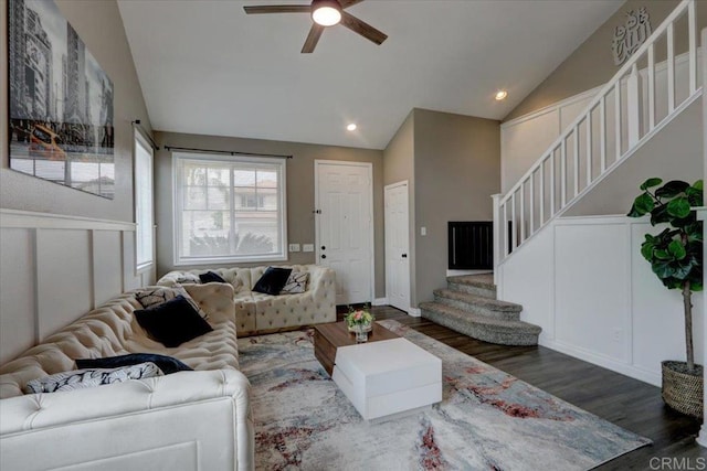 29567 Castlewood Dr, Menifee, CA 92584 - living area with stairway, a decorative wall, wood finished floors, ceiling fan, and high vaulted ceiling