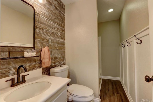 29567 Castlewood Dr, Menifee, CA 92584 - bathroom featuring toilet, vanity, wood finished floors, baseboards, and a shower with curtain