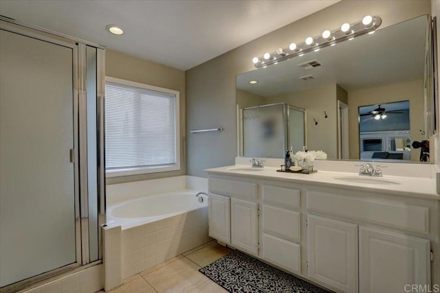 29567 Castlewood Dr, Menifee, CA 92584 - bathroom with a shower stall, double vanity, a garden tub, tile patterned flooring, and ceiling fan