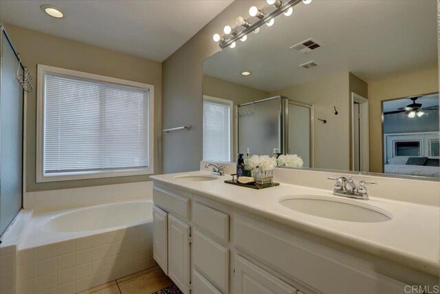 29567 Castlewood Dr, Menifee, CA 92584 - full bath featuring double vanity, a stall shower, a garden tub, tile patterned floors, and ensuite bath