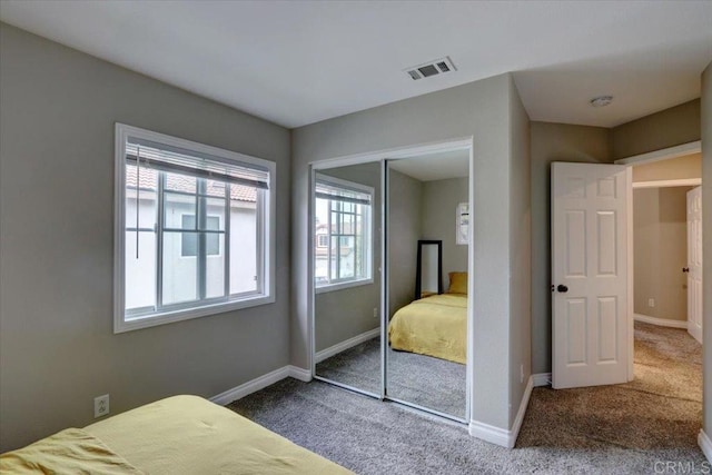 29567 Castlewood Dr, Menifee, CA 92584 - carpeted bedroom with multiple windows, a closet, and baseboards