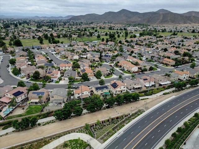 29567 Castlewood Dr, Menifee, CA 92584 - aerial overview of property's location featuring a mountainous background, nearby suburban area, and a highway