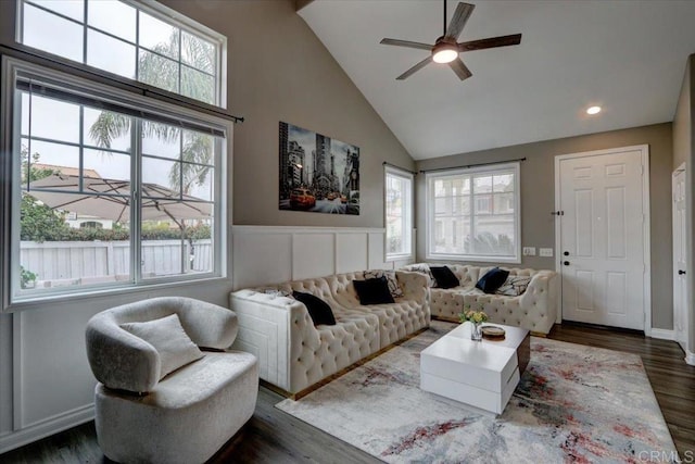 29567 Castlewood Dr, Menifee, CA 92584 - living area with ceiling fan, plenty of natural light, dark wood-style flooring, a wainscoted wall, and high vaulted ceiling