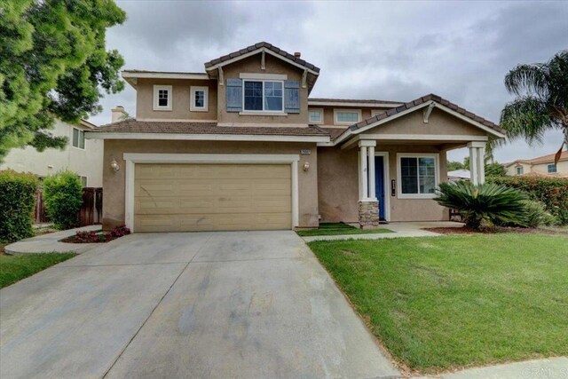 29567 Castlewood Dr, Menifee, CA 92584 - view of front of home with stucco siding, concrete driveway, an attached garage, and a tile roof