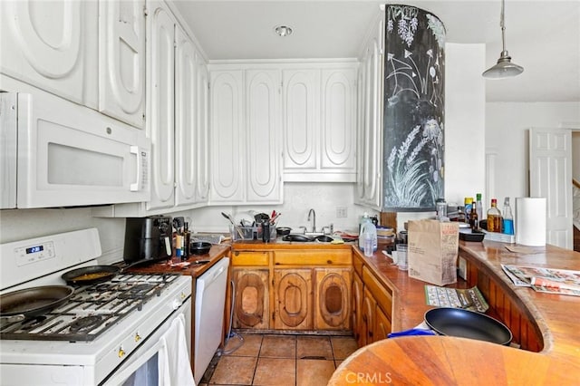 831 Rio Chico Way, Chico, CA 95928 - kitchen featuring white appliances, a sink, white cabinets, and light tile patterned floors