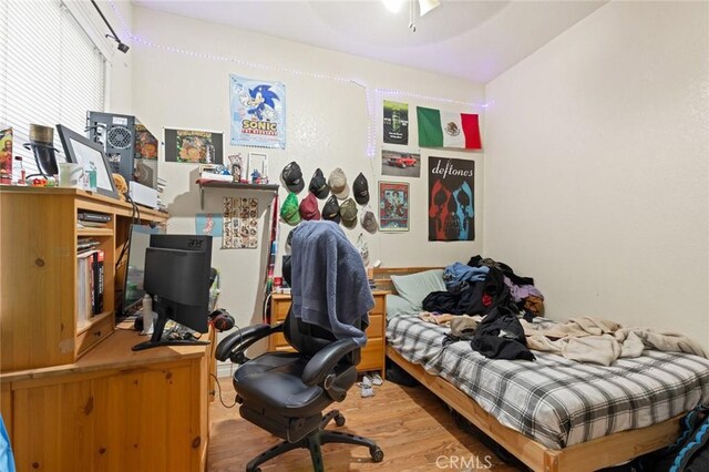 831 Rio Chico Way, Chico, CA 95928 - bedroom with wood finished floors and an office area