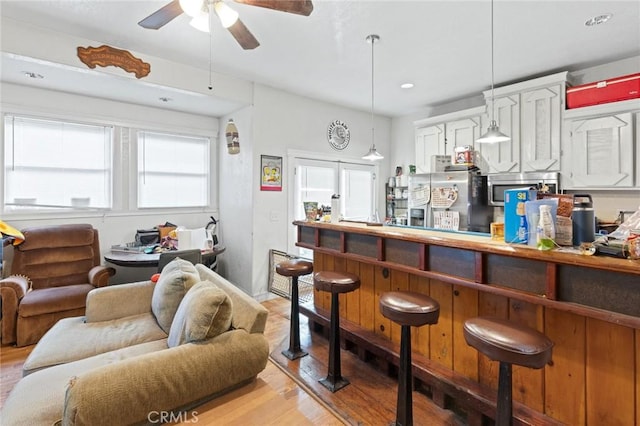 831 Rio Chico Way, Chico, CA 95928 - indoor dry bar featuring light wood-style floors, a ceiling fan, hanging light fixtures, stainless steel appliances, and recessed lighting