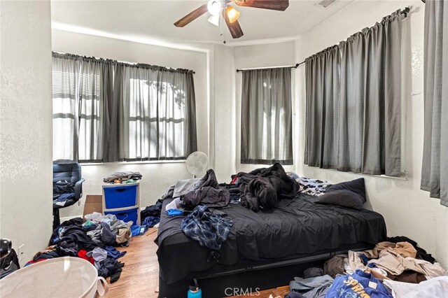 831 Rio Chico Way, Chico, CA 95928 - bedroom featuring wood finished floors, a textured wall, and ceiling fan