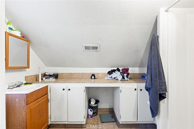 831 Rio Chico Way, Chico, CA 95928 - laundry room featuring a sink and light tile patterned floors