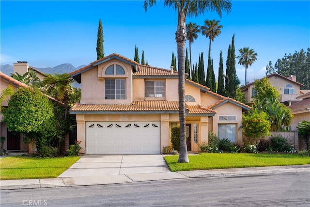 10274 Corkwood Ct, Rancho Cucamonga, CA 91737 - view of front of home with driveway, stucco siding, a tiled roof, an attached garage, and a front yard