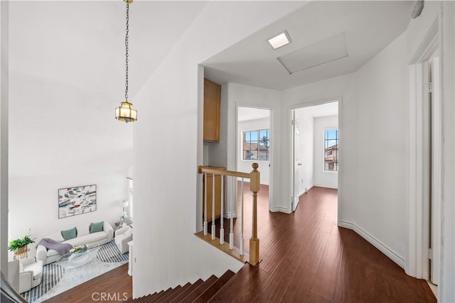10274 Corkwood Ct, Rancho Cucamonga, CA 91737 - corridor with an upstairs landing, dark wood finished floors, attic access, and baseboards