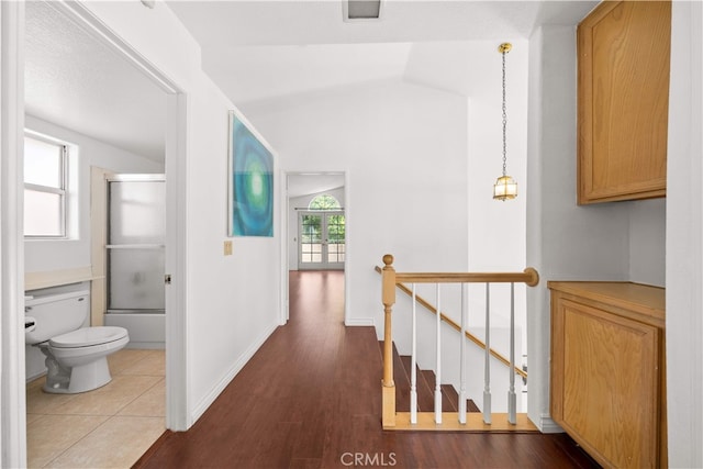 10274 Corkwood Ct, Rancho Cucamonga, CA 91737 - hallway featuring an upstairs landing, wood finished floors, baseboards, and lofted ceiling