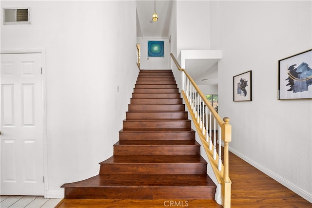 10274 Corkwood Ct, Rancho Cucamonga, CA 91737 - staircase with baseboards and wood finished floors