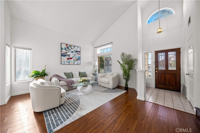 10274 Corkwood Ct, Rancho Cucamonga, CA 91737 - foyer featuring high vaulted ceiling, baseboards, and wood finished floors