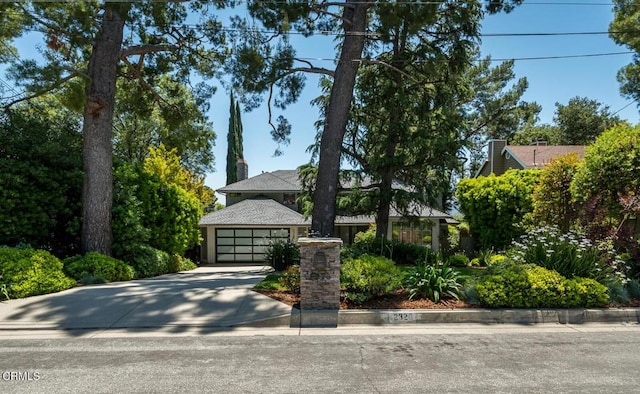 2320 Mountain Ave, La Crescenta, CA 91214 - view of front facade with concrete driveway and a chimney
