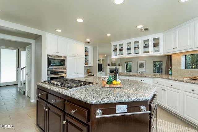 2320 Mountain Ave, La Crescenta, CA 91214 - kitchen featuring stainless steel appliances, dark brown cabinetry, white cabinets, glass insert cabinets, and recessed lighting