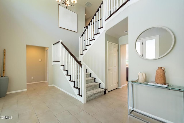 2320 Mountain Ave, La Crescenta, CA 91214 - staircase with a high ceiling, tile patterned floors, baseboards, and a chandelier