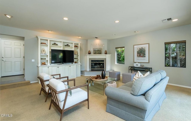 2320 Mountain Ave, La Crescenta, CA 91214 - living area featuring light colored carpet, baseboards, recessed lighting, and a glass covered fireplace
