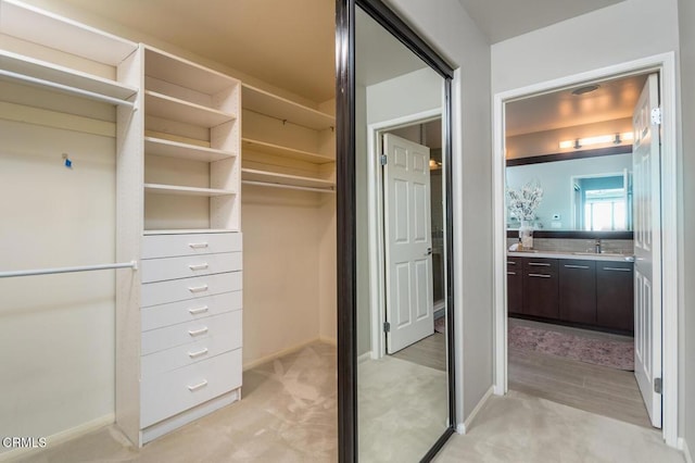 2320 Mountain Ave, La Crescenta, CA 91214 - spacious closet featuring a sink and light colored carpet