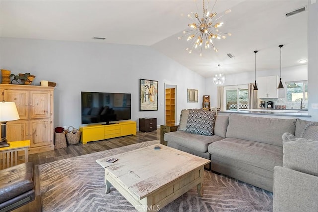 2750 Lazy Hill Rd, San Miguel, CA 93451 - living room featuring a chandelier, vaulted ceiling, and wood finished floors