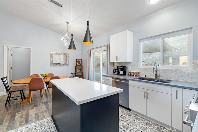 2750 Lazy Hill Rd, San Miguel, CA 93451 - kitchen featuring stainless steel dishwasher, a sink, a center island, white cabinets, and tasteful backsplash