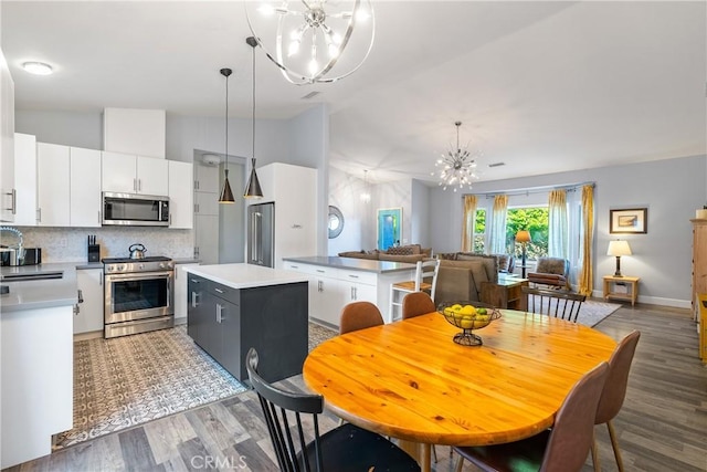 2750 Lazy Hill Rd, San Miguel, CA 93451 - dining space with a chandelier, lofted ceiling, light wood-style floors, and baseboards