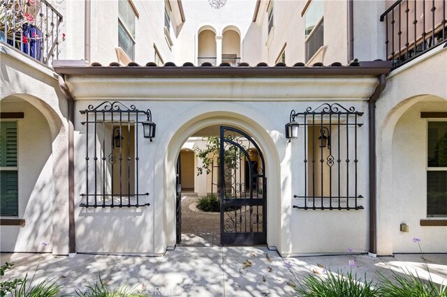 405 Mallorca Ln, Brea, CA 92823 - entrance to property featuring stucco siding and a gate