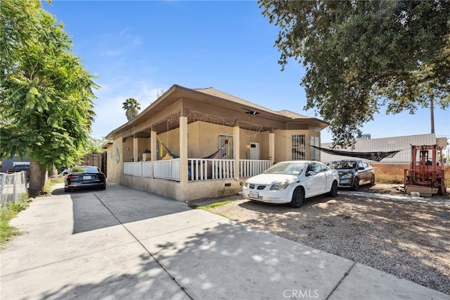 673 W 9th St, San Bernardino, CA 92410 - view of front facade featuring driveway and stucco siding