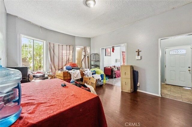 673 W 9th St, San Bernardino, CA 92410 - bedroom featuring wood finished floors and a textured ceiling