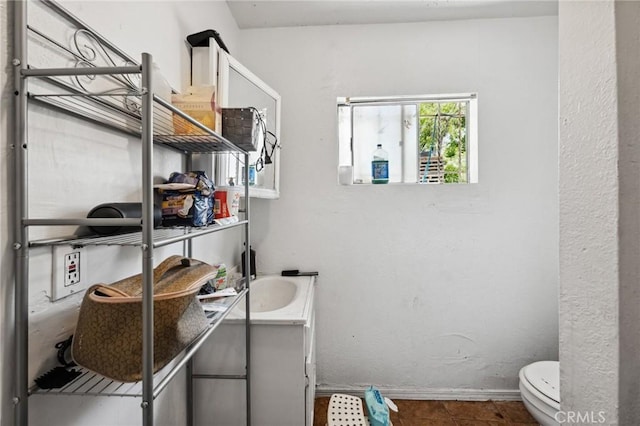 673 W 9th St, San Bernardino, CA 92410 - bathroom with toilet and vanity
