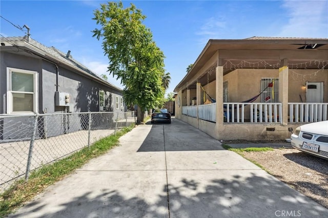 673 W 9th St, San Bernardino, CA 92410 - view of property exterior featuring stucco siding and driveway