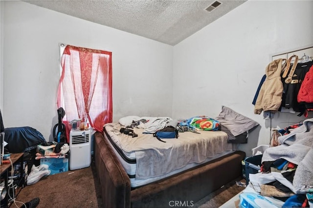 673 W 9th St, San Bernardino, CA 92410 - bedroom with a textured ceiling, vaulted ceiling, and carpet floors