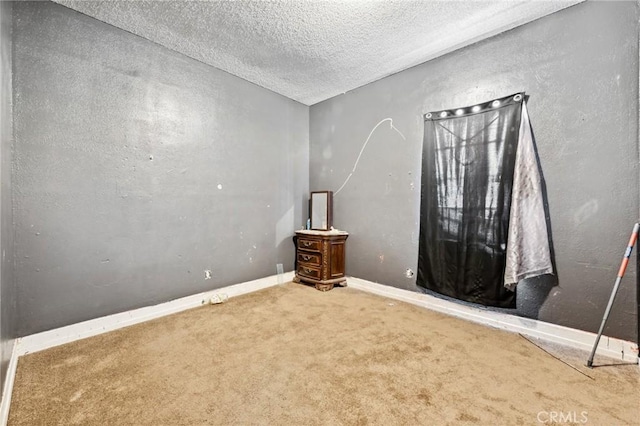 673 W 9th St, San Bernardino, CA 92410 - empty room with carpet flooring, a textured ceiling, and baseboards