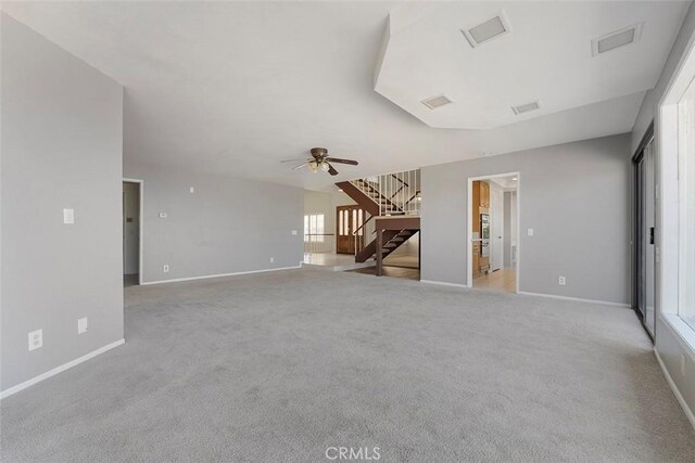 16227 Glencove Dr, Hacienda Heights, CA 91745 - unfurnished living room with stairs, light carpet, baseboards, and a ceiling fan