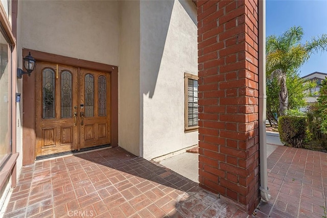 16227 Glencove Dr, Hacienda Heights, CA 91745 - view of exterior entry featuring stucco siding and brick siding