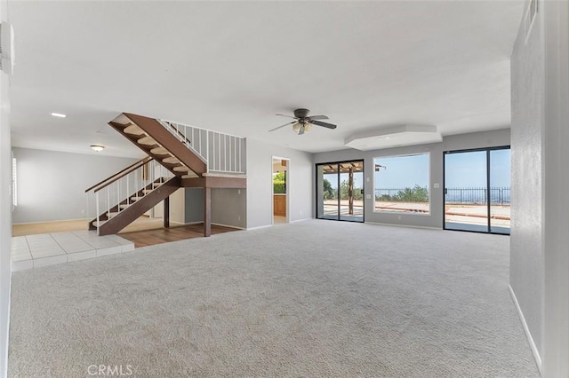 16227 Glencove Dr, Hacienda Heights, CA 91745 - unfurnished living room with baseboards, stairs, carpet flooring, and a ceiling fan