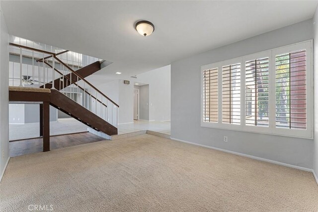 16227 Glencove Dr, Hacienda Heights, CA 91745 - unfurnished living room with carpet, baseboards, and stairway