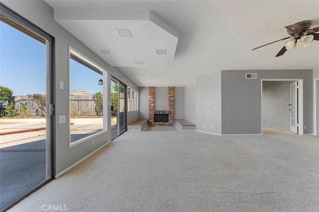 16227 Glencove Dr, Hacienda Heights, CA 91745 - unfurnished living room featuring light colored carpet, ceiling fan, baseboards, and a fireplace