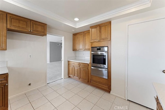 16227 Glencove Dr, Hacienda Heights, CA 91745 - kitchen featuring a warming drawer, oven, a raised ceiling, brown cabinetry, and crown molding