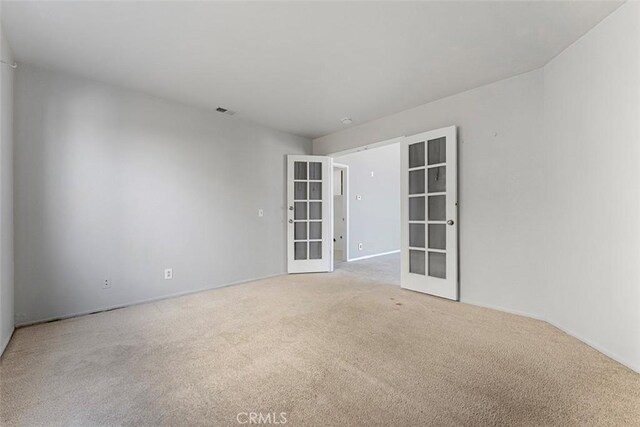 16227 Glencove Dr, Hacienda Heights, CA 91745 - spare room with french doors, carpet floors, and baseboards