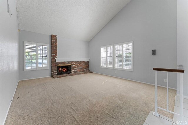 16227 Glencove Dr, Hacienda Heights, CA 91745 - unfurnished living room featuring high vaulted ceiling, carpet, baseboards, a fireplace, and a textured ceiling
