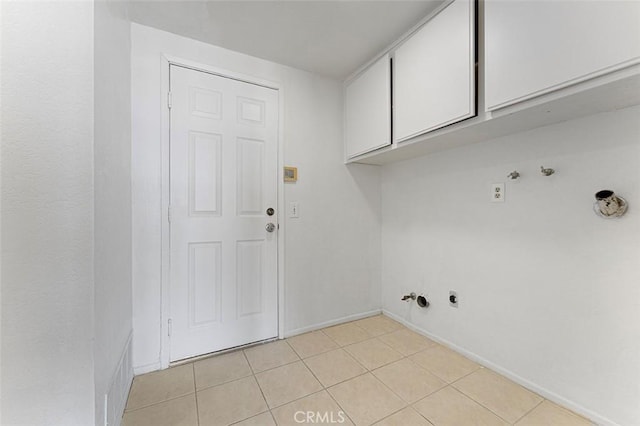 16227 Glencove Dr, Hacienda Heights, CA 91745 - laundry area featuring gas dryer hookup, cabinet space, light tile patterned flooring, and baseboards