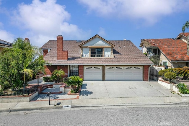 16227 Glencove Dr, Hacienda Heights, CA 91745 - traditional home featuring concrete driveway, brick siding, a chimney, and a garage