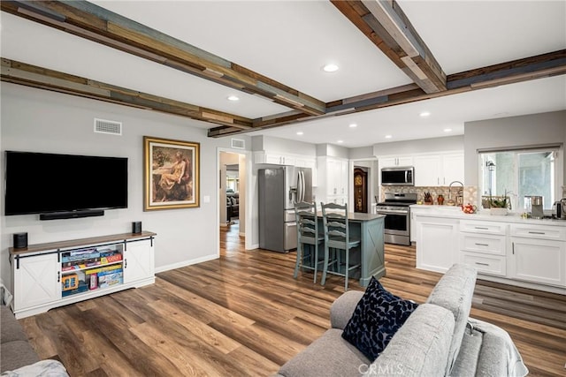 1624 Kingston Rd, Placentia, CA 92870 - living area with beam ceiling, dark wood-style floors, baseboards, and recessed lighting