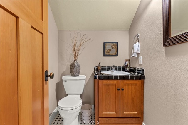 5 Sycamore Valley Rd, Chico, CA 95973 - bathroom featuring toilet, vanity, baseboards, and a textured wall