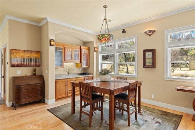 5 Sycamore Valley Rd, Chico, CA 95973 - dining room with light wood-style floors, crown molding, healthy amount of natural light, and baseboards
