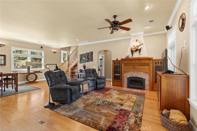 5 Sycamore Valley Rd, Chico, CA 95973 - living area featuring light wood-style floors, ceiling fan, stairway, arched walkways, and ornamental molding