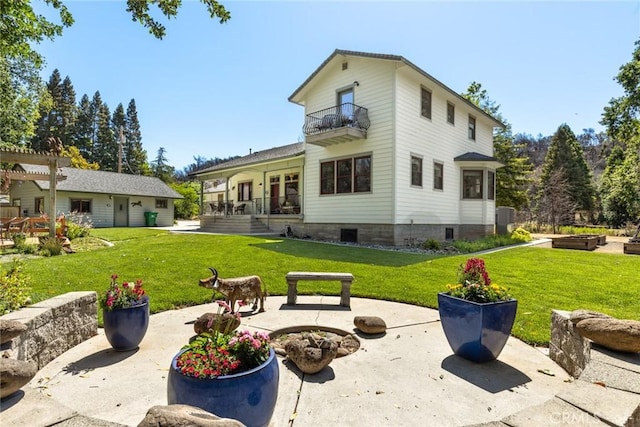 5 Sycamore Valley Rd, Chico, CA 95973 - back of house with a balcony, a lawn, and a patio
