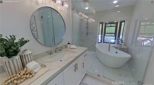 12312 Eveningside Dr, Santa Ana, CA 92705 - full bathroom with vanity, a soaking tub, walk in shower, and marble finish floors