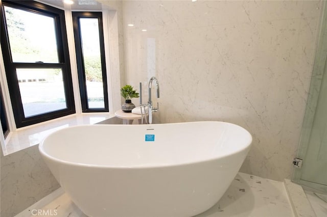 12312 Eveningside Dr, Santa Ana, CA 92705 - bathroom with marble tiled flooring, a freestanding tub, and a sink